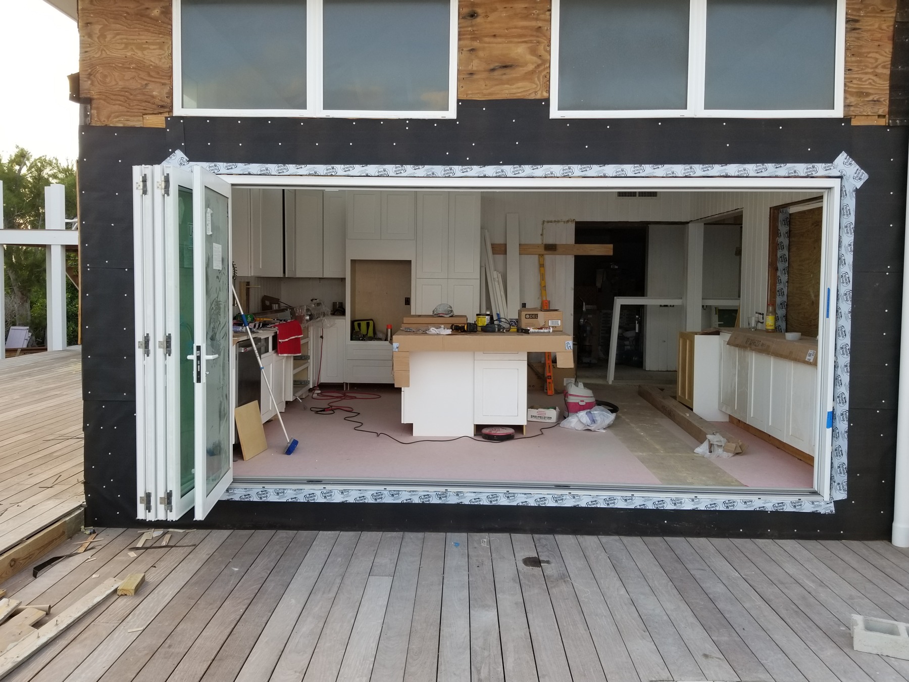 The same kitchen opening with the folding panels opened before the storm.