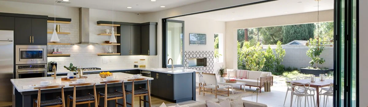 Custom Lanai glass doors opening a living space