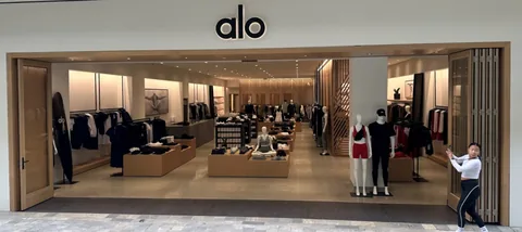 Wood folding panels opening a shop to a covered walkway.