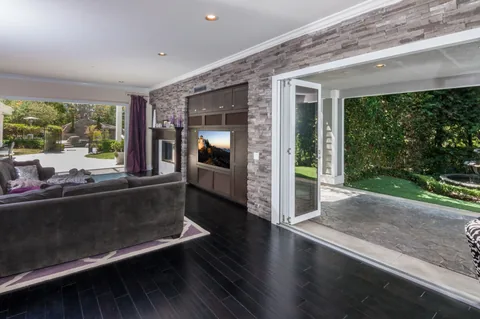 A close view of a screened opening between a living room and patio.