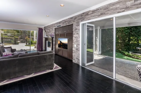 Screening along the edge of an open living-room doorway.