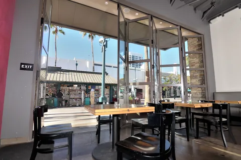 Folding aluminum windows above a restaurant counter.