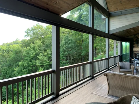 A screened porch with hurricane aluminum glazing along the deck.