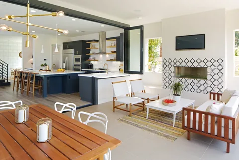 Open kitchen windows connecting indoor and outdoor counter seating.